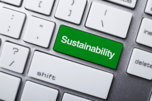 A keyboard with a green sustainability button instead of an enter button.
